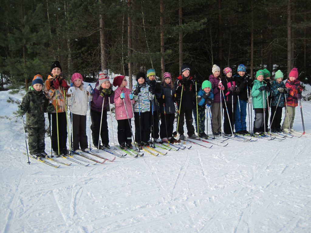 Difi tries our camera and snaps a group photo of the skiers